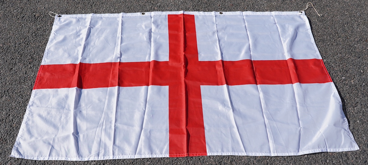A vintage Union flag, approximately 240 x 120cm, a smaller “Sale” flag and other assorted flags and bunting. Condition - fair